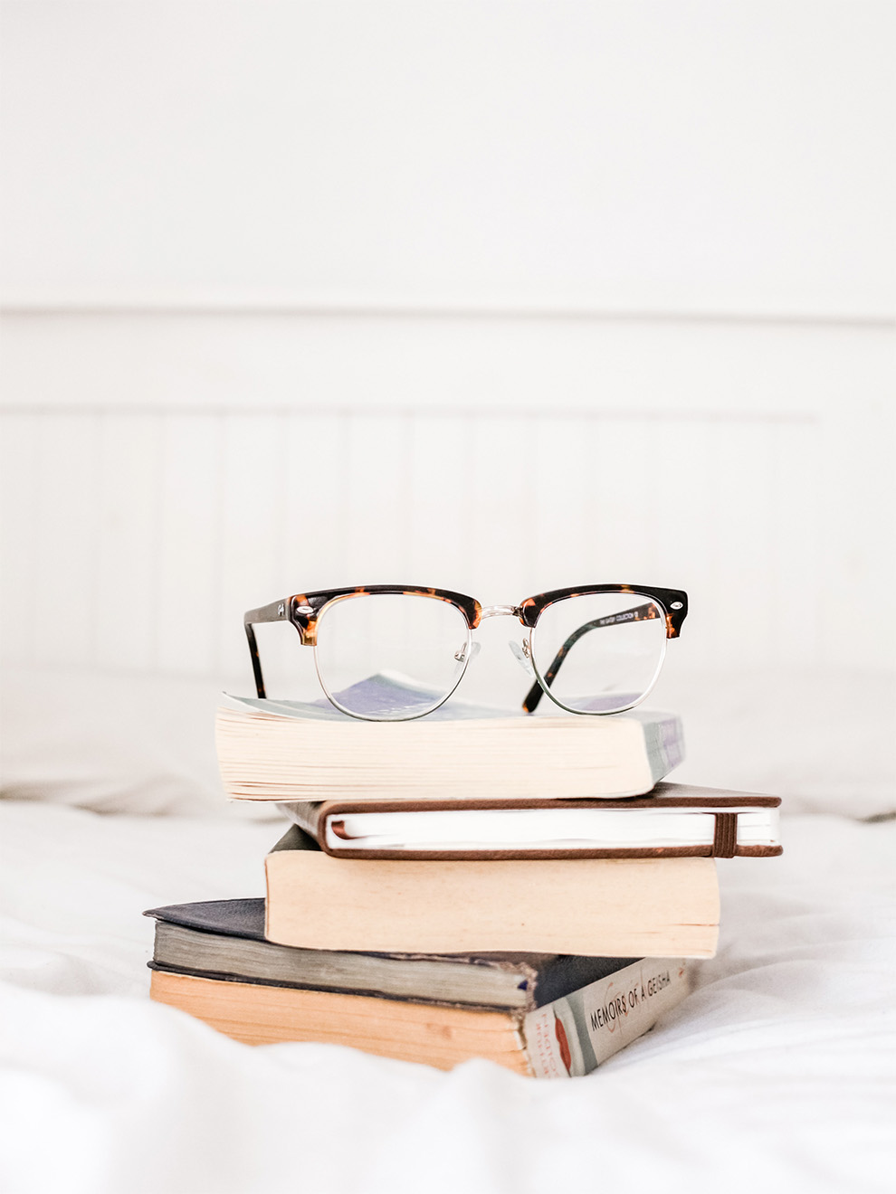 Glasses on Stack of Books