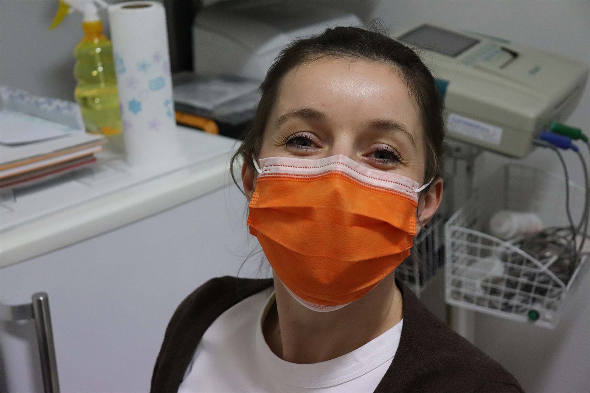 Dental nurse smiling behind mask